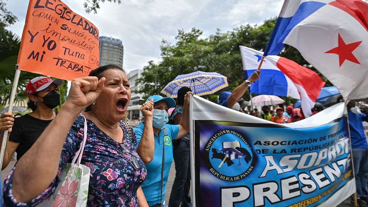 Demonstrators with Panama's national flags take part in a protest against the high cost of food and gasoline in Panama City. Credit: Reuters photo