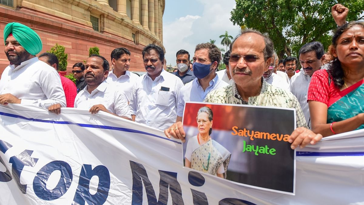 Congress MPs Rahul Gandhi, Adhir Ranjan Chowdhury and others conduct a protest march against ED questioning of party's interim president Sonia Gandhi in the National Herald case, at Parliament House in New Delhi. Credit: PTI Photo