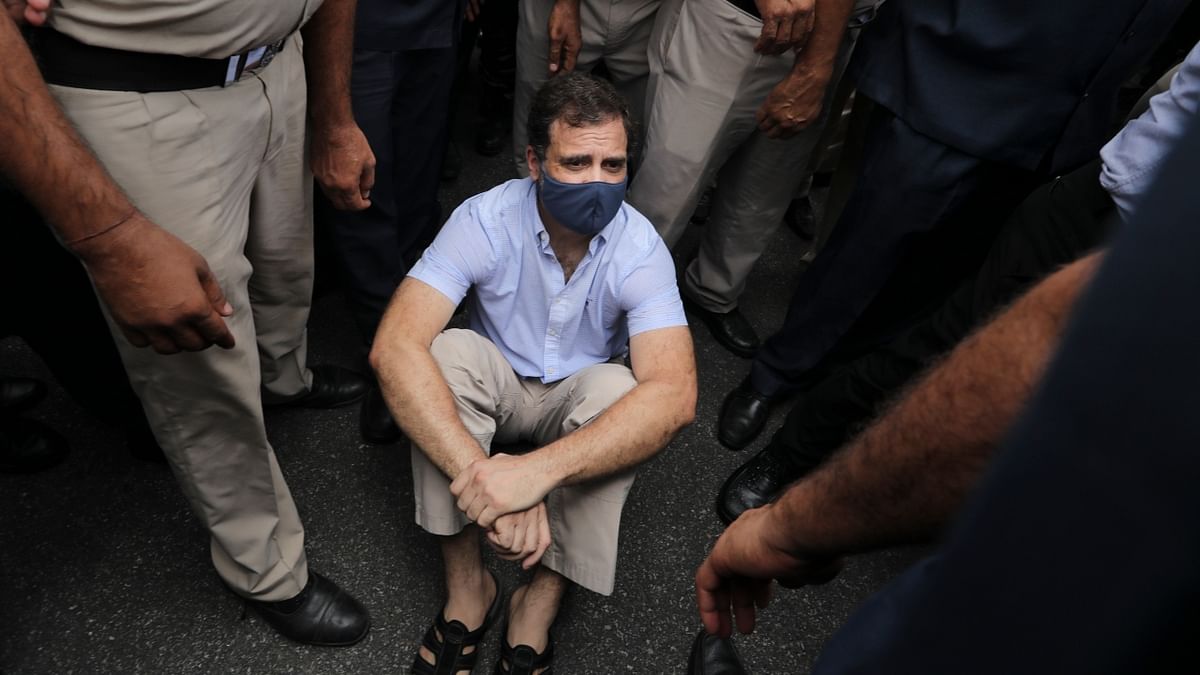 Congress leader Rahul Gandhi was seen sitting on the road at Vijay Chowk during the protest march from Parliament. Credit: PTI Photo