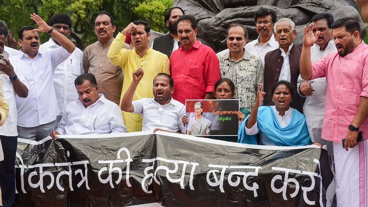 Congress MPs stage a protest against ED's interrogation of Congress President Sonia Gandhi in the National Herald case, at Parliament House. Credit: PTI Photo