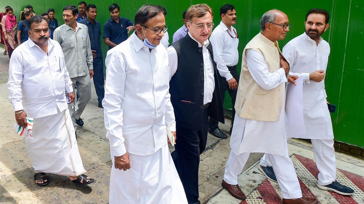 Congress MPs P Chidambaram, Vivek Tankha, Digvijaya Singh, Shaktisinh Gohil and others conduct a protest march against ED questioning of party's interim president Sonia Gandhi in National Herald case, at Parliament House in New Delhi. Credit: PTI Photo