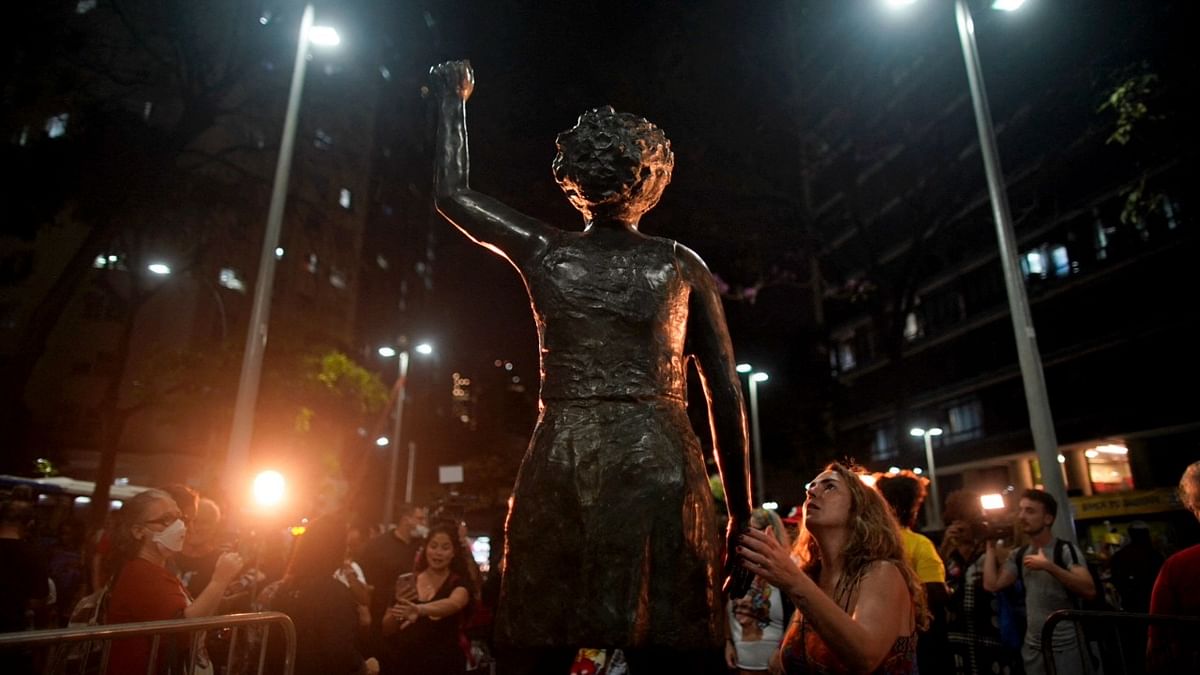 People attend the unveiling of the late human rights activist and councilwoman Marielle Franco's statue at the Buraco do Lume square, downtown Rio de Janeiro, Brazil. Credit: AFP Photo