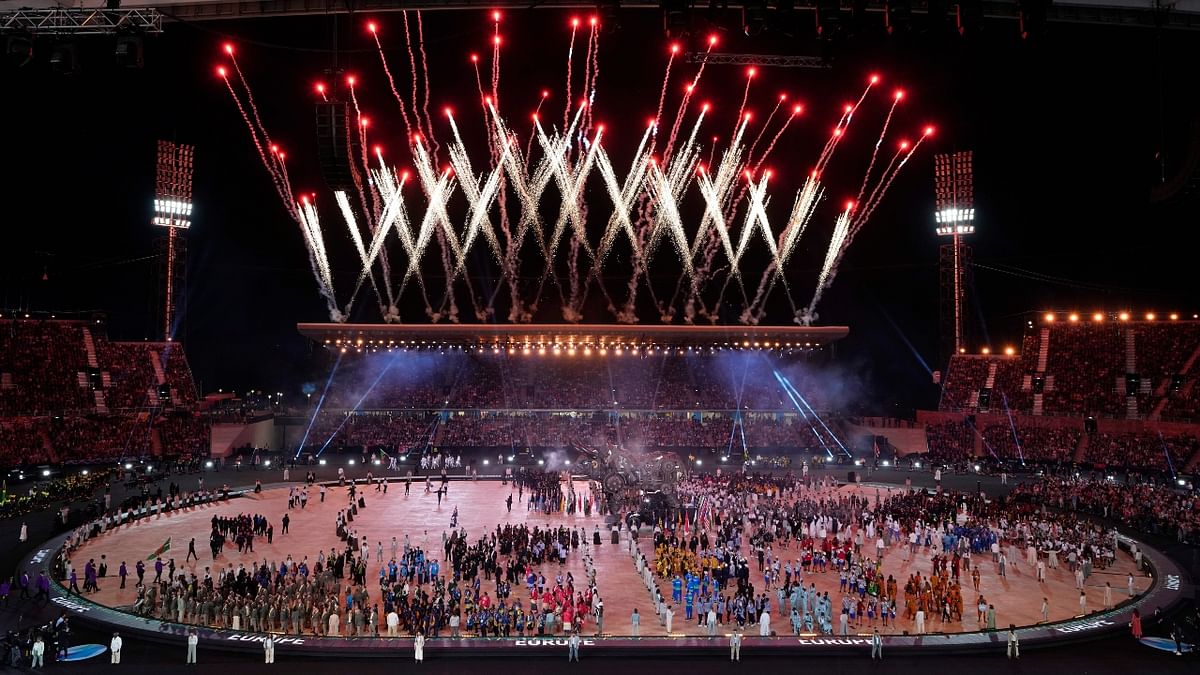 Fireworks go off as the athletes enter the stadium. Credit: AP Photo