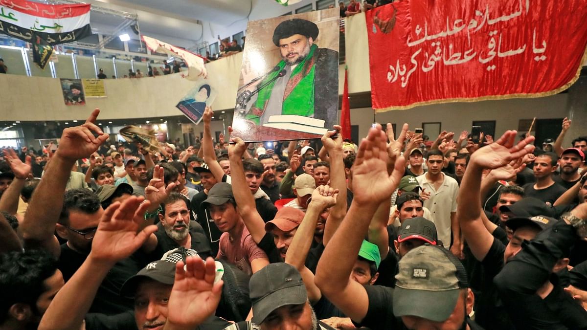 Supporters of Iraqi cleric Moqtada Sadr, take part in a mourning ritual amid the Shiite Ashura commemoration period as they occupy Iraq's parliament in the capital Baghdad's high-security Green Zone while protesting a rival political bloc's nomination for prime minister. Credit: AFP Photo