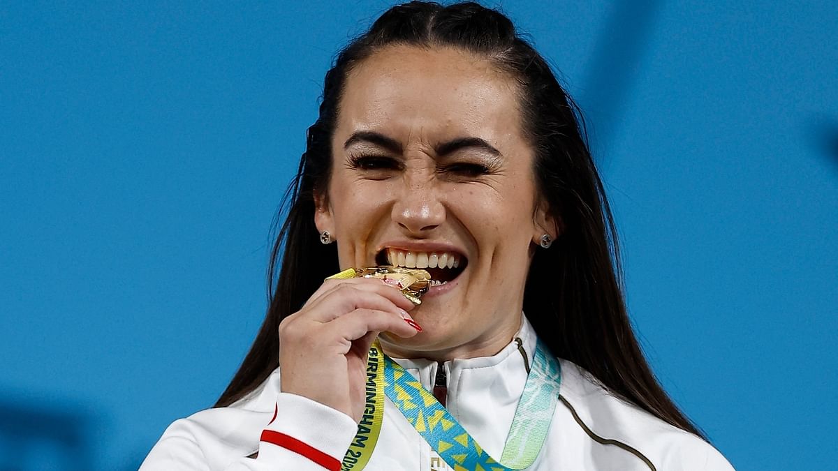 Former beauty queen-turned-weightlifter Sarah Davies, who had won Miss Leeds and Miss Intercontinental England titles, clinched a gold medal in women's weightlifting at the Birmingham Commonwealth Games. Credit: Reuters Photo