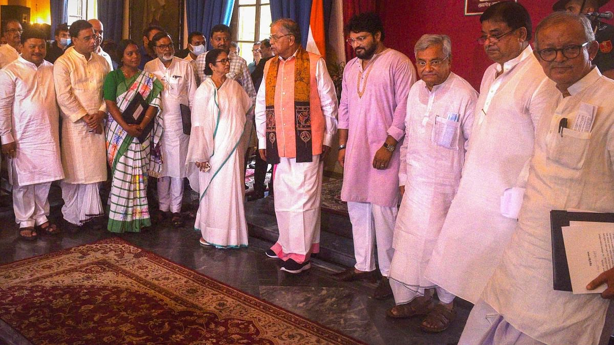 Of the nine, five were administered oath as cabinet ministers, two as ministers of state and two others as ministers of state - independent charge by Governor La Ganesan. Credit: PTI Photo