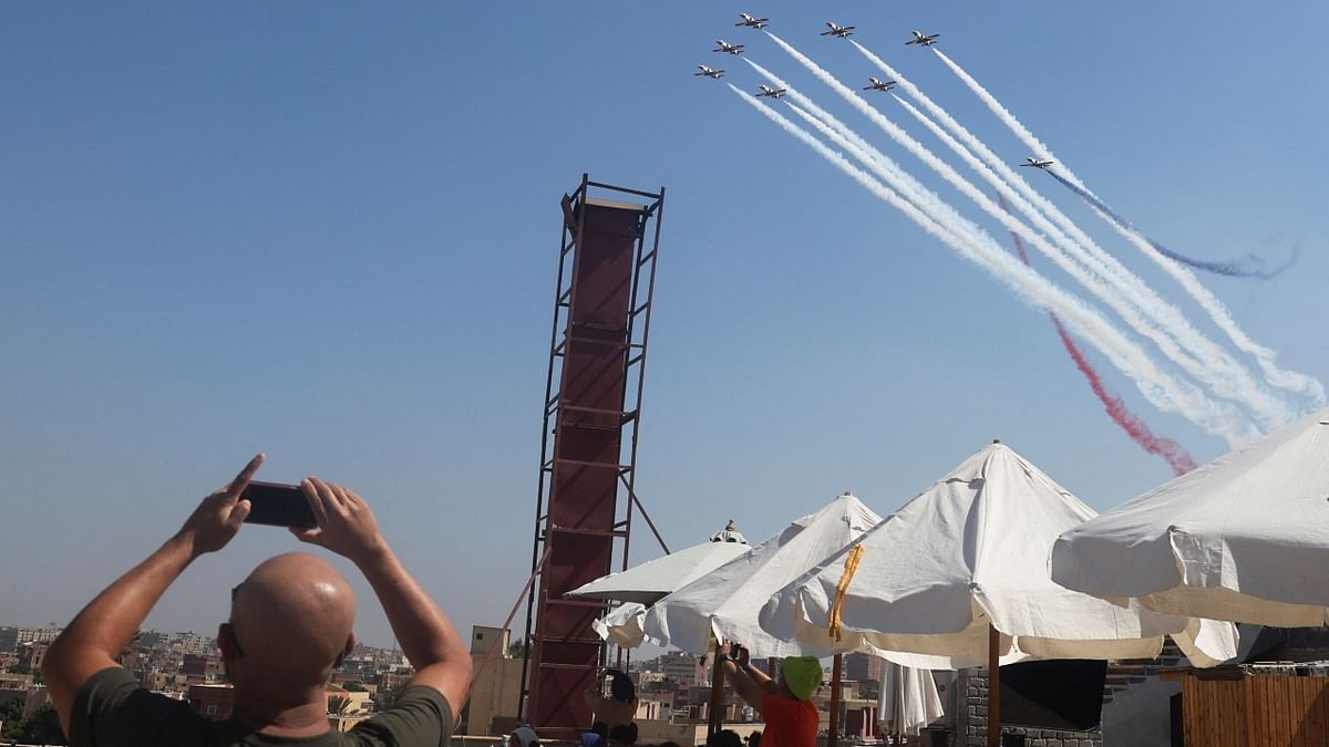 People watch Pyramids Air Show 2022 at the Pyramids Plateau in Giza, Egypt. Credit: Reuters Photo