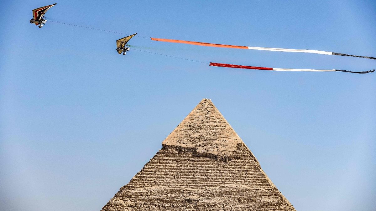 Ultralight trike flyers fly above the Pyramid of Khafre during Egypt's Pyramids Air Show 2022. Credit: AFP Photo
