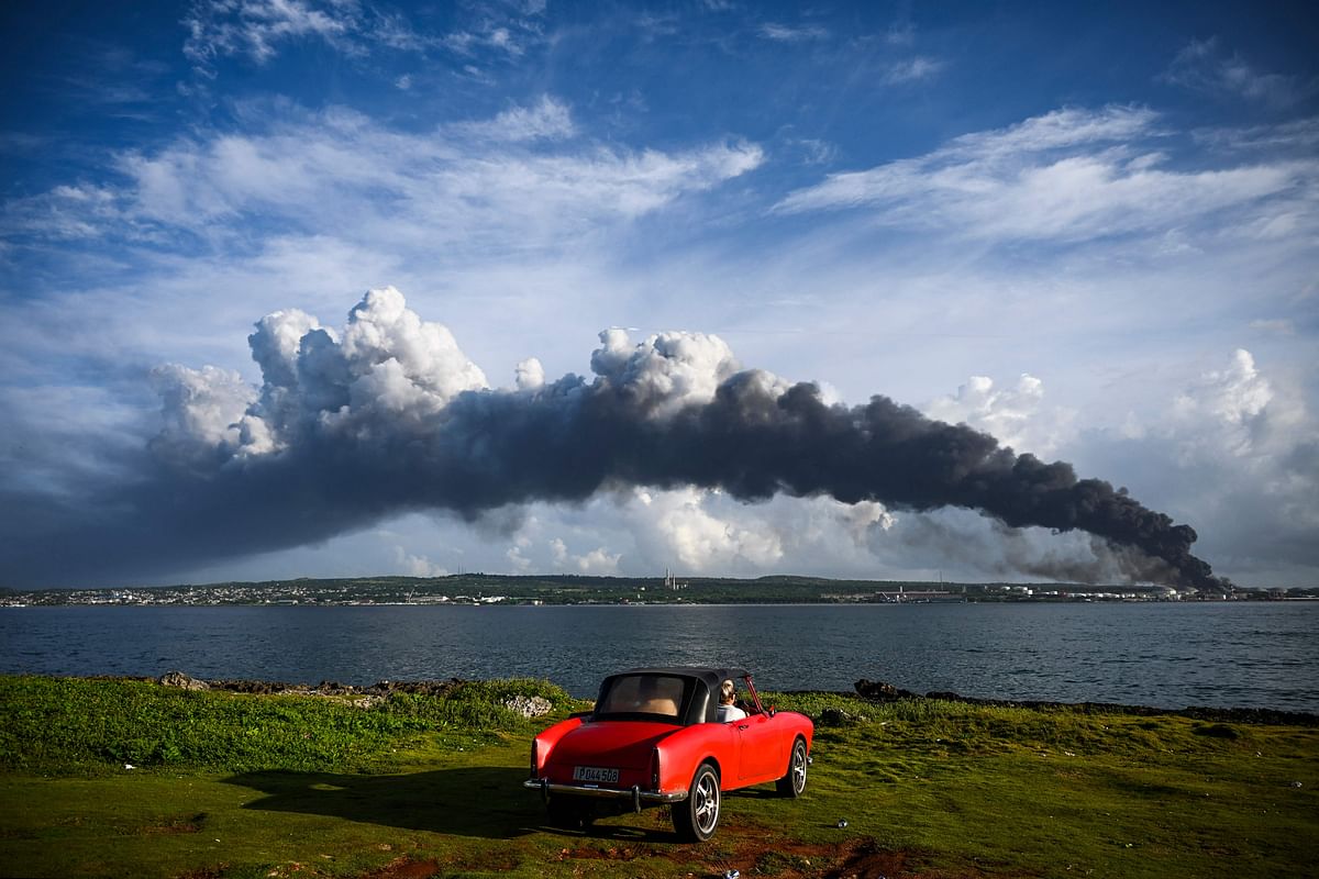 Black smoke from oil tanks on fire is seen near the Matanzas bay, Cuba, on August 7, 2022. Credit: AFP Photo