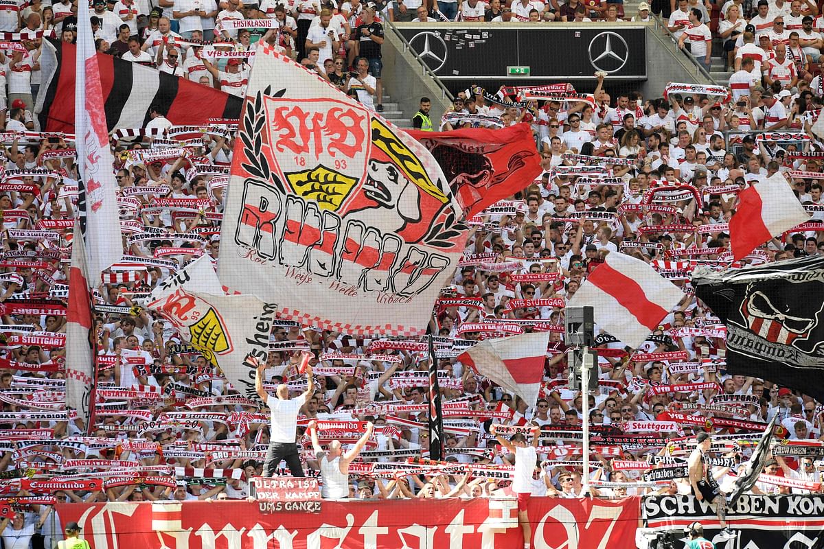 Stuttgart fans cheer for their team with flags prior to the German first division Bundesliga football match between VfB Stuttgart and RB Leipzig in Stuttgart, southwestern Germany. Credit: AFP Photo