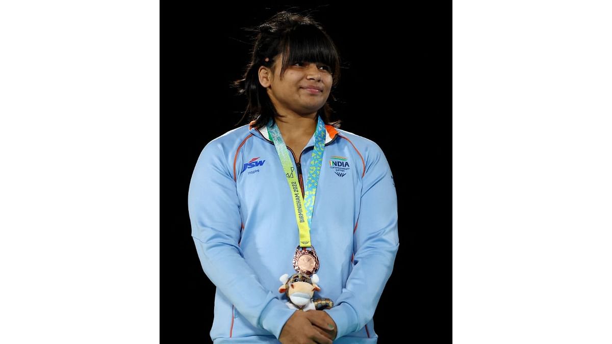 Divya Kakran clinched a bronze in 68kg, winning the medal play-off in just 26 seconds against Tonga's Tiger Lily. Credit: Reuters Photo