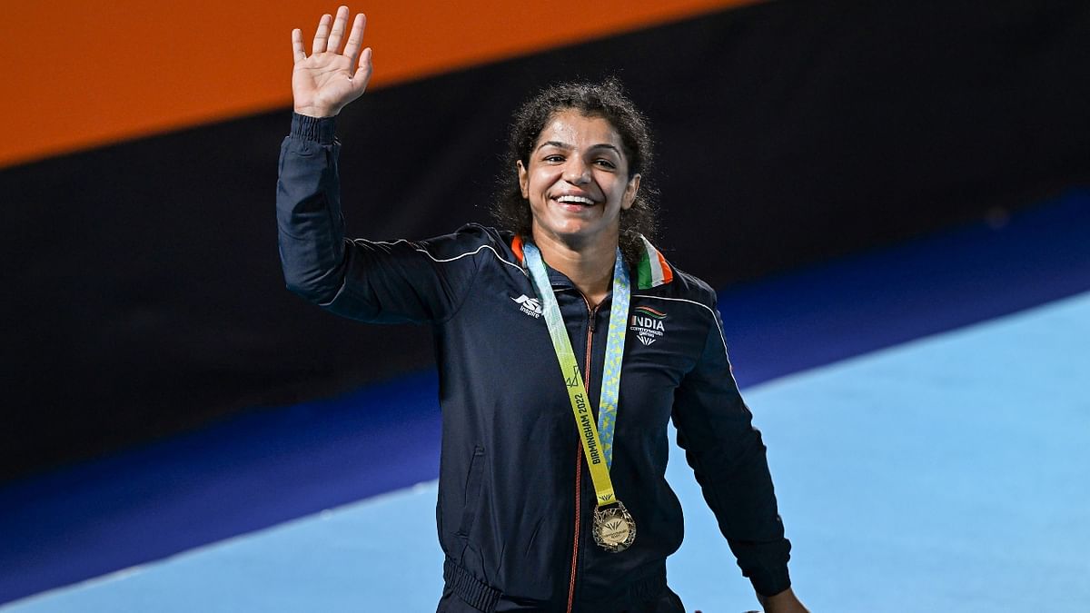Rio Olympics bronze medallist Sakshi Malik turned back the clock to register a dominant victory to bag gold medal in the women's freestyle 65kg bout, beating Canada's Ana Godinez Gonzalez by fall in the Commonwealth Games. Credit: PTI Photo