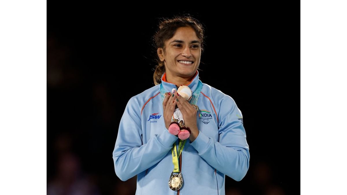 Vinesh Phogat won the women's 53kg gold medal at the CWG 2022. Her win was special as she created history by winning her third consecutive gold in wrestling at Commonwealth Games. Credit: Reuters Photo