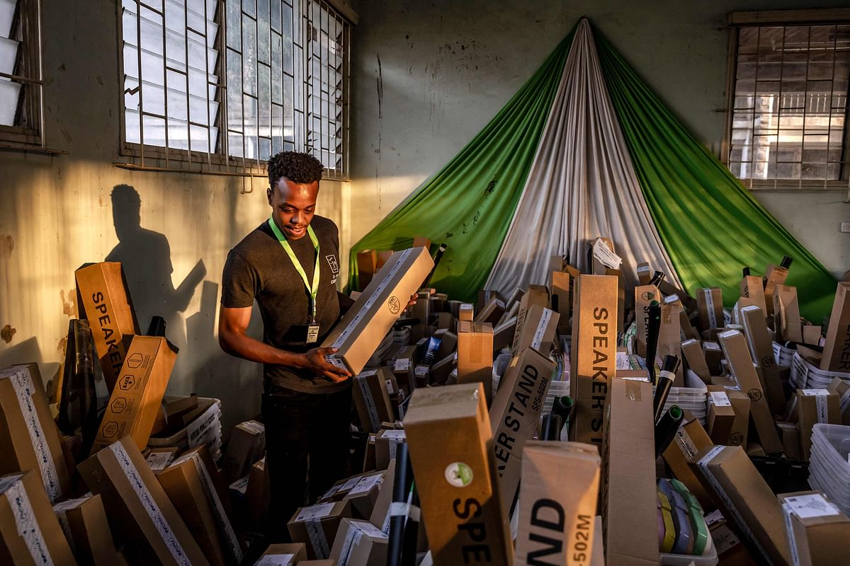 An IEBC Election Official works preparing electoral material of the Independent Electoral and Boundaries Commission (IEBC) at a tallying centre in Nairobi, Kenya. Credit: AFP Photo