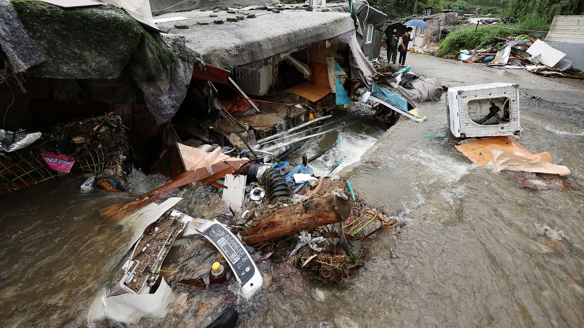 Three people were found dead in the debris of landslides and a collapsed bus station in the nearby cities of Gwangju and Hwaseong. Credit: Reuters Photo