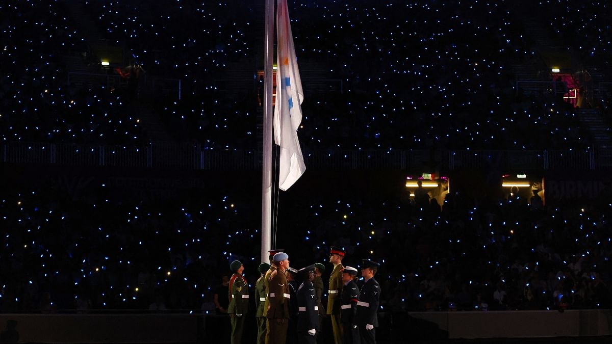 As per the tradition, the flag of the Commonwealth Games Federation, was lowered to officially mark the end of the Birmingham Games and handed over to the state of Victoria, Australia, the host of the next edition of the Commonwealth Games in 2026. Credit: Reuters Photo