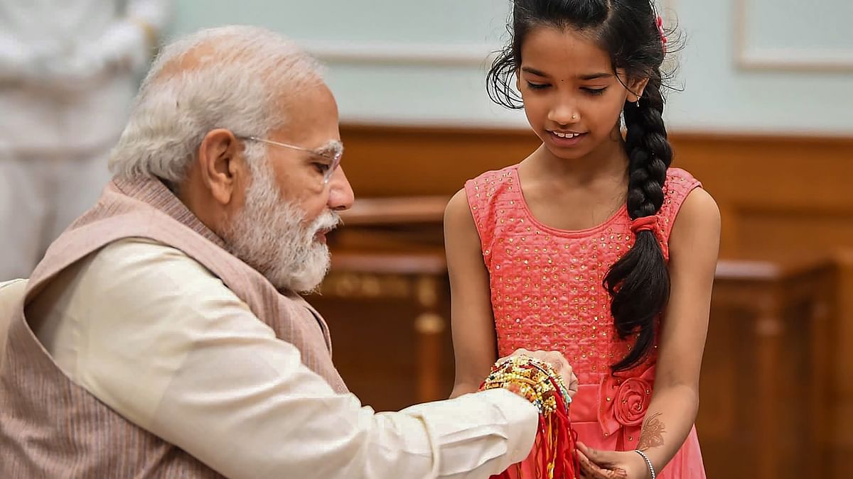 Prime Minister Narendra Modi celebrated Raksha Bandhan with the daughters of his office staff tying rakhis on his wrist. Credit: Twitter/@narendramodi