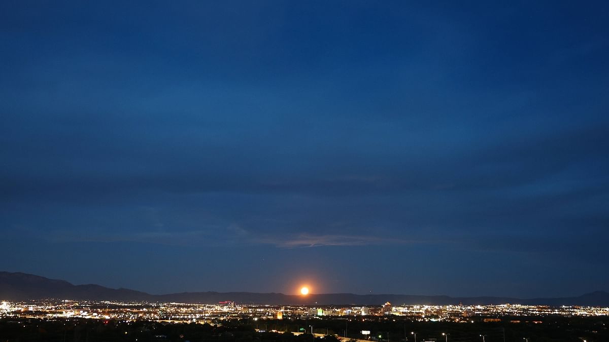 The Sturgeon Moon rises beyond Albuquerque in New Mexico. The Sturgeon Moon is the fourth and final super moon of 2022. Credit: AFP Photo