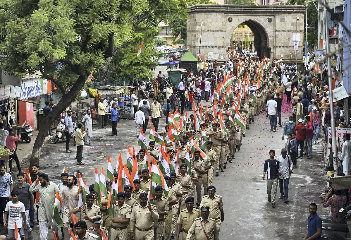 Gujarat Police personnel participate in a 'Tiranga Yatra', organised as part of 'Azadi Ka Amrit Mahotsav' celebrations to commemorate 75 years of Indian independence. Credit: PTI Photo