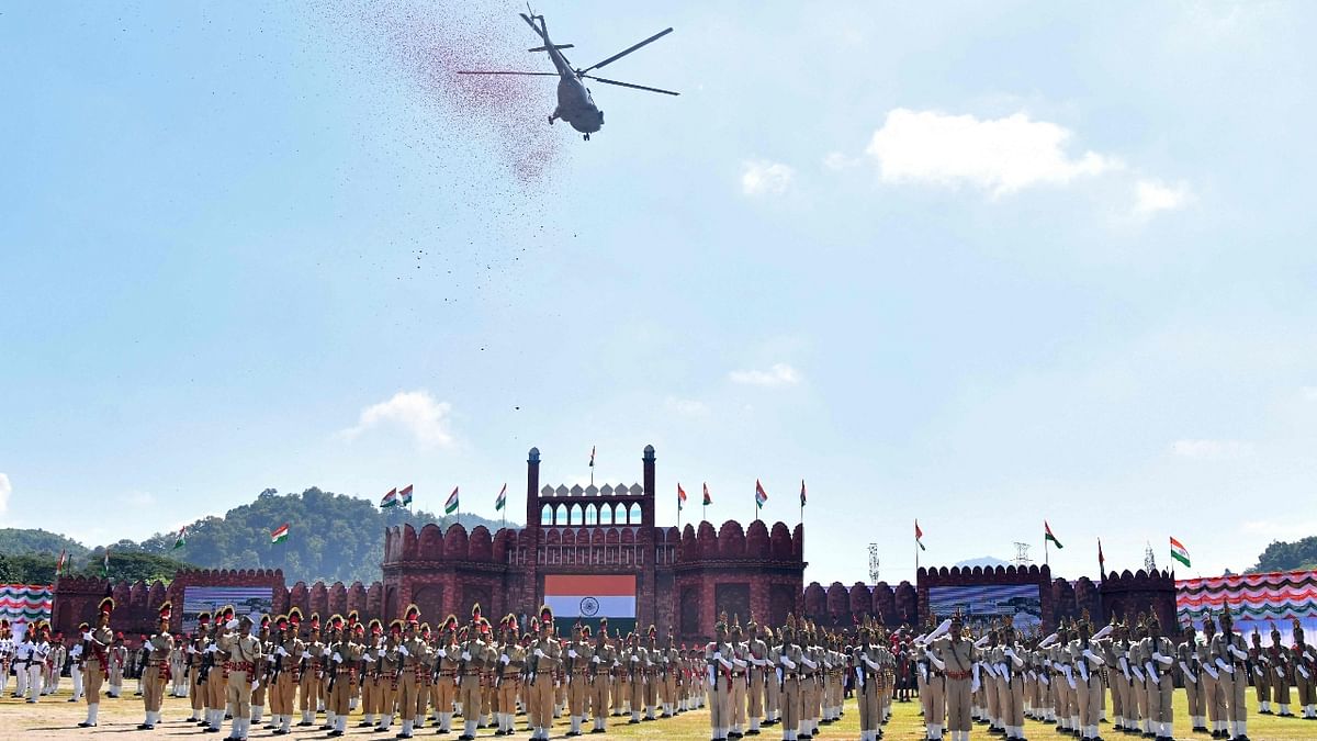 An Indian Air Force (IAF) helicopter showers flower petals during the celebrations to mark country’s 75th Independence Day in Guwahati. Credit: AFP Photo
