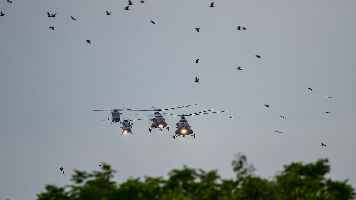 Helicopters arrive to shower flower petals during the 76th Independence Day function at the Red Fort, in New Delhi. Credit: PTI Photo