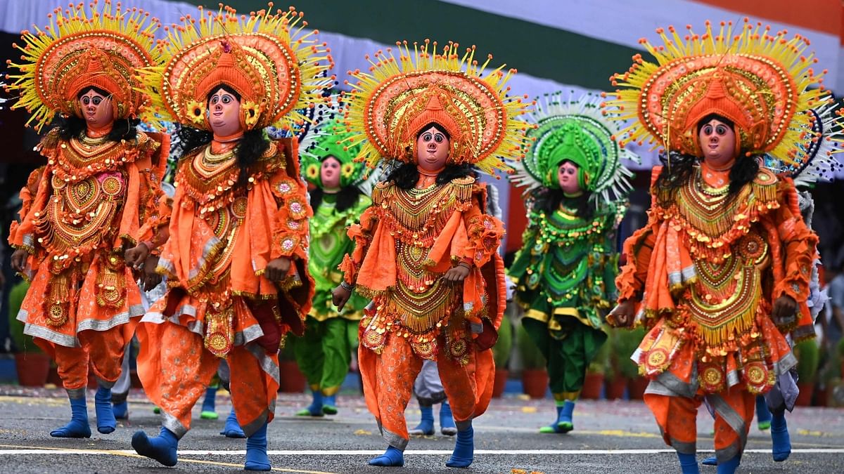 Folk dancers perform a traditional 'Chhou' dance during the celebrations to mark India's 75th Independence Day at the Red Road in Kolkata. Credit: AFP Photo