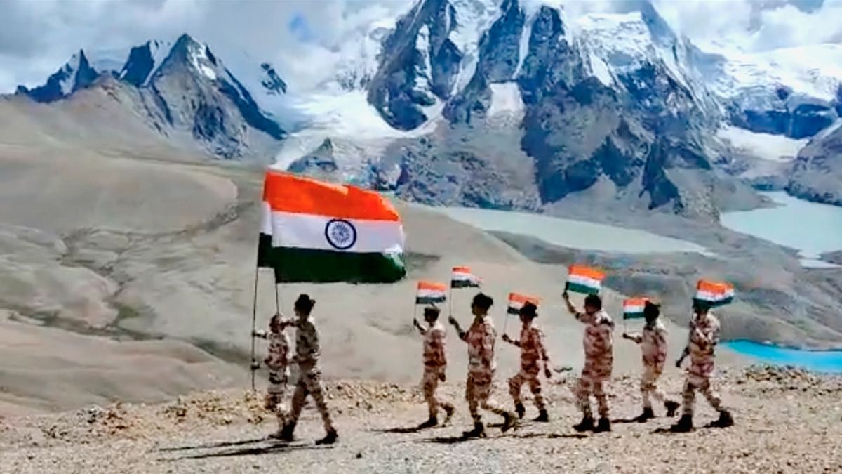 Indo-Tibetan Border Police (ITBP) personnel celebrate the 76th Independence Day, near a mountain peak at 18,800 feet in Sikkim. Credit: ITBP
