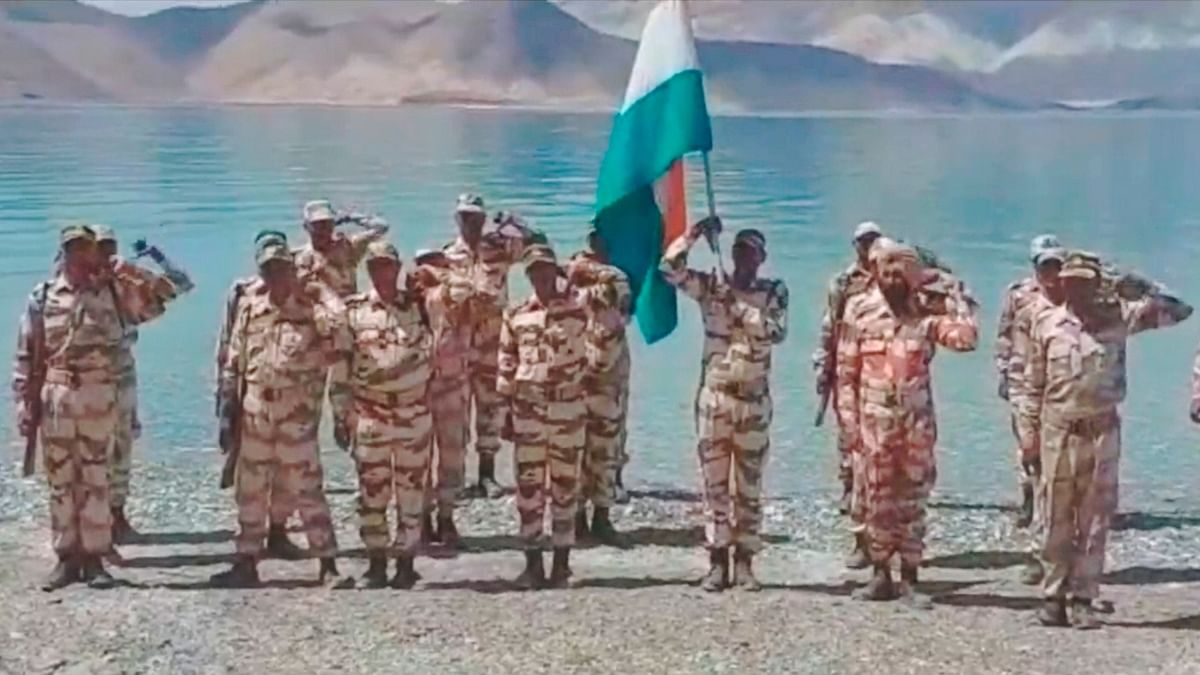 Indo-Tibetan Border Police (ITBP) personnel celebrate the 76th Independence Day, at the banks of Pangong Tso in Ladakh. Credit: PTI Photo