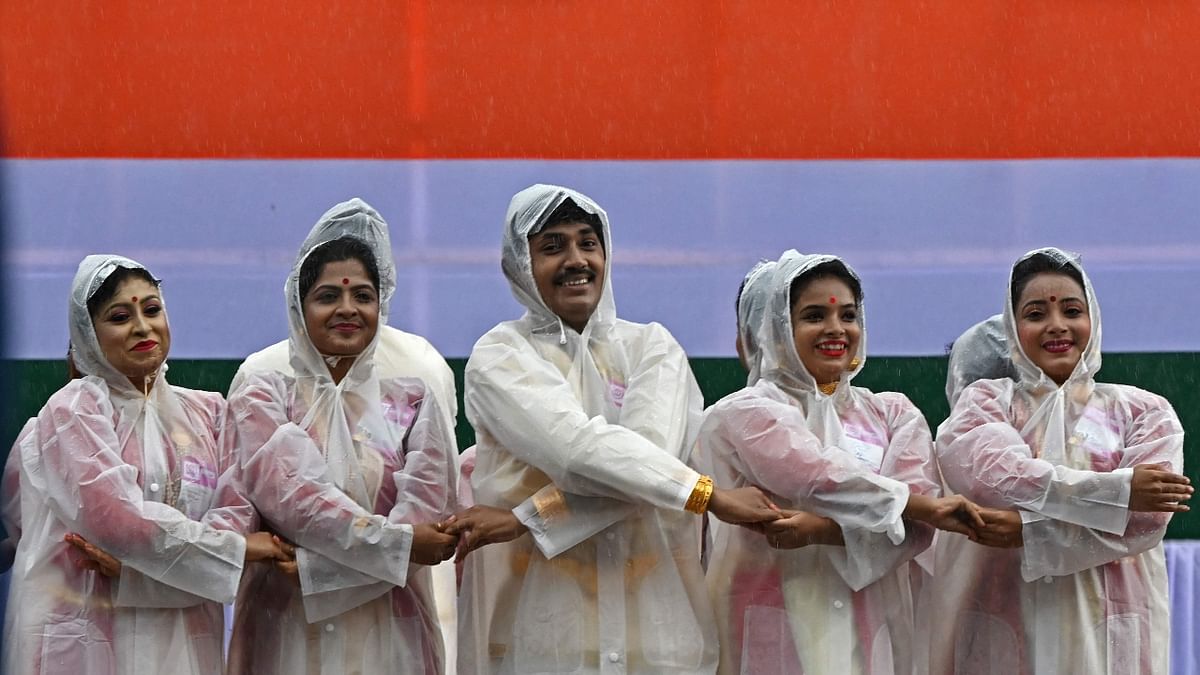 Participants perform during the celebrations to mark India's 75th Independence Day at the Red Road in Kolkata. Credit: AFP Photo