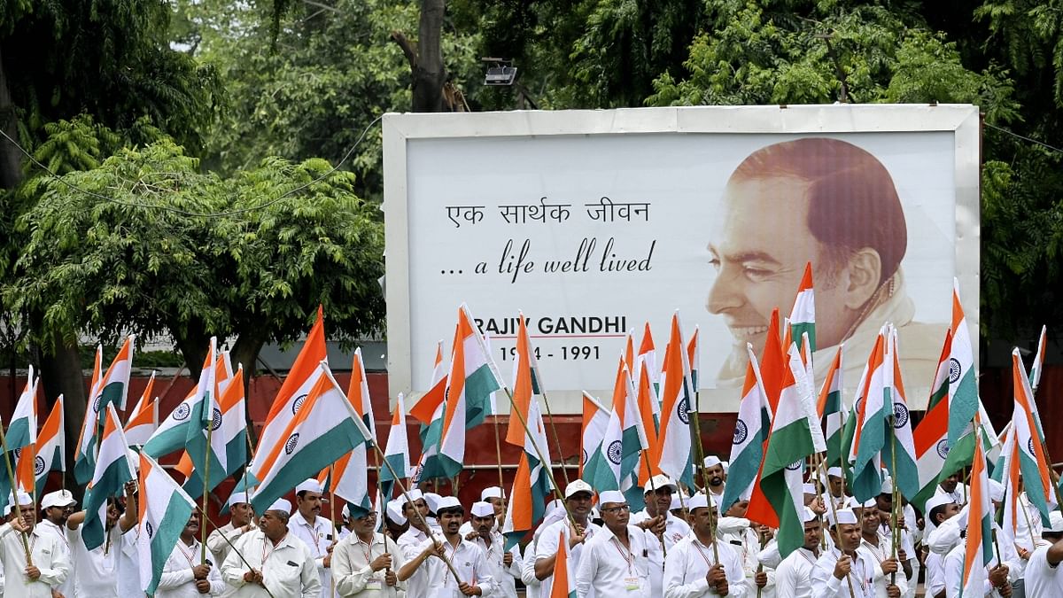 Congress Seva Dal members during the party's ceremony for the hoisting of the National Flag on the occasion of 76th Independence Day, at AICC Headquarters in New Delhi. Credit: PTI Photo