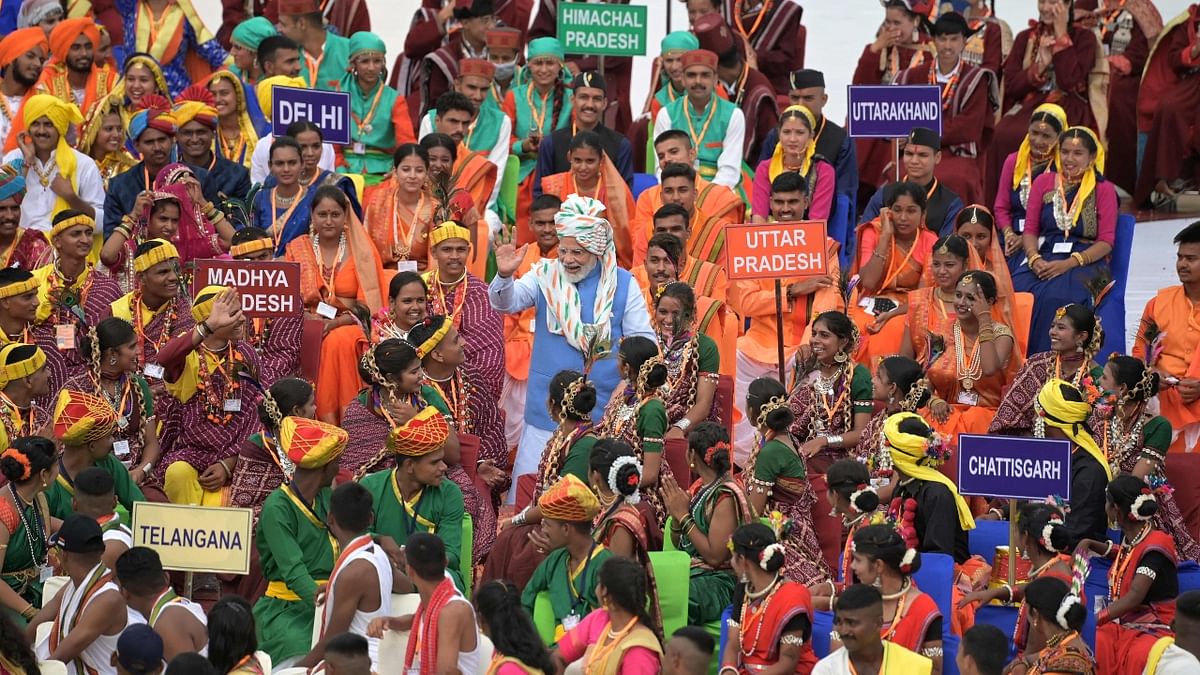 Prime Minister Narendra Modi greets the participants after addressing the nation from the ramparts of the Red Fort during the celebrations to mark country’s Independence Day in New Delhi. Credit: AFP Photo