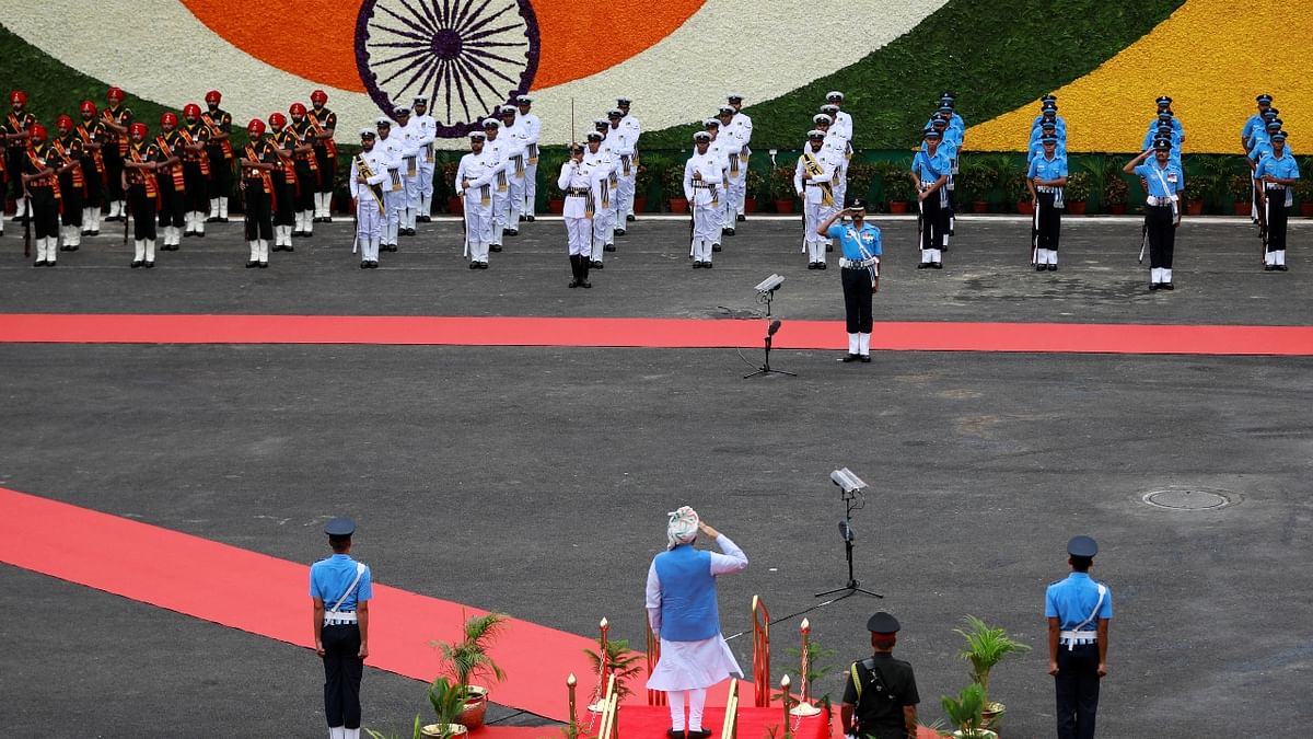 Prime Minister Narendra Modi inspects the guard of honour during the Independence Day celebrations at the Red Fort in Delhi. Credit: Reuters Photo