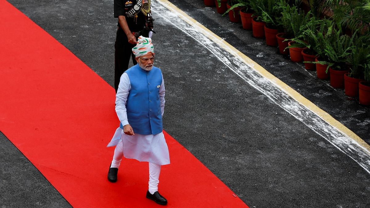 Dressed in a traditional kurta and churidar along with a light blue jacket, the highlight of his outfit was the tricolour-themed safa which also kept up with the theme of 'Azadi Ka Amrit Mahotsav'. Credit: Reuters Photo