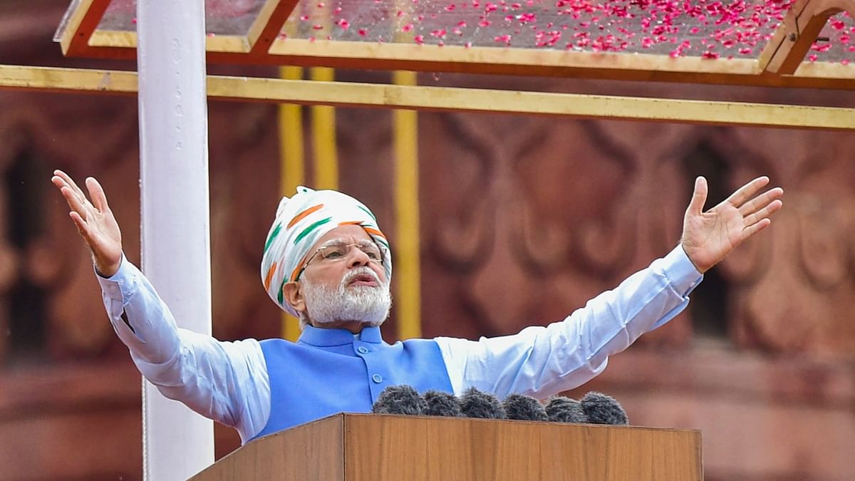 This year, which marks his ninth consecutive Independence Day address to the nation, the prime minister wore a white safa with tricolour motifs. Credit: PTI Photo