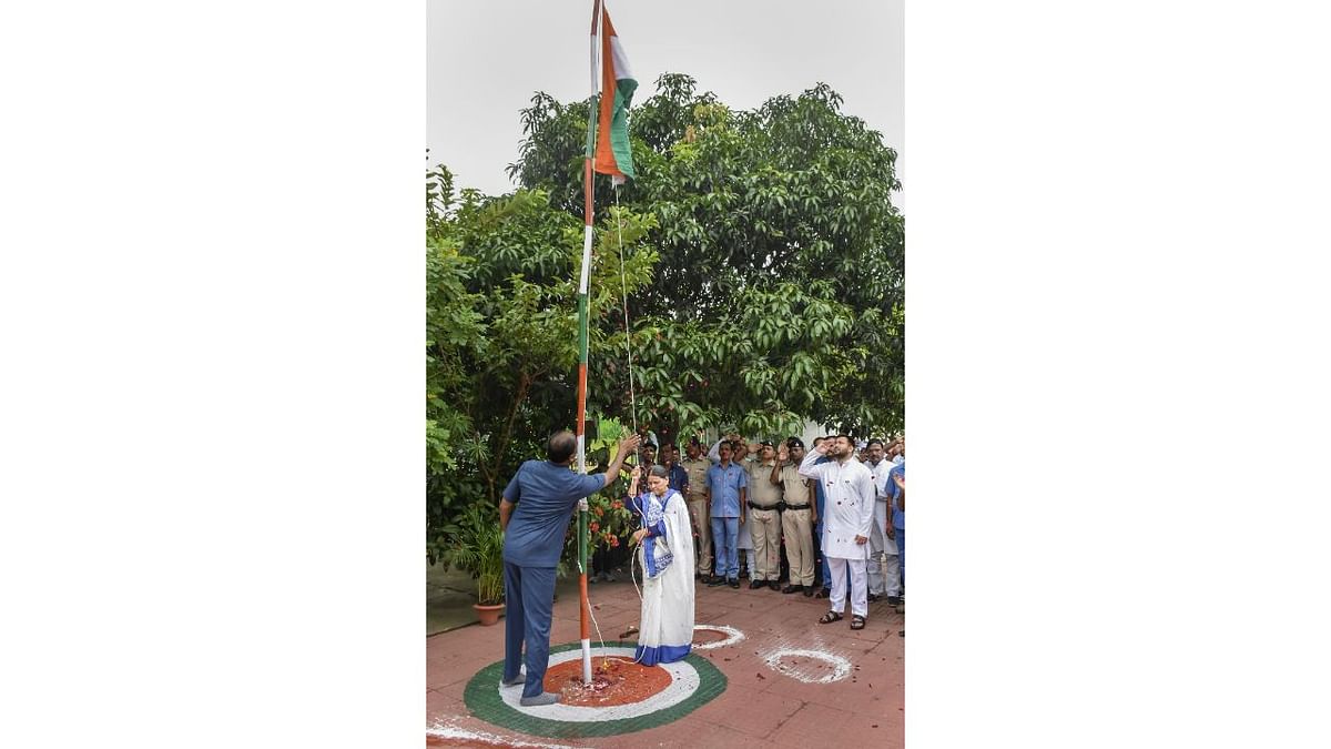 RJD senior leader Rabri Devi hoists the national flag on the occasion of the 76th Independence Day in Patna. Credit: PTI Photo