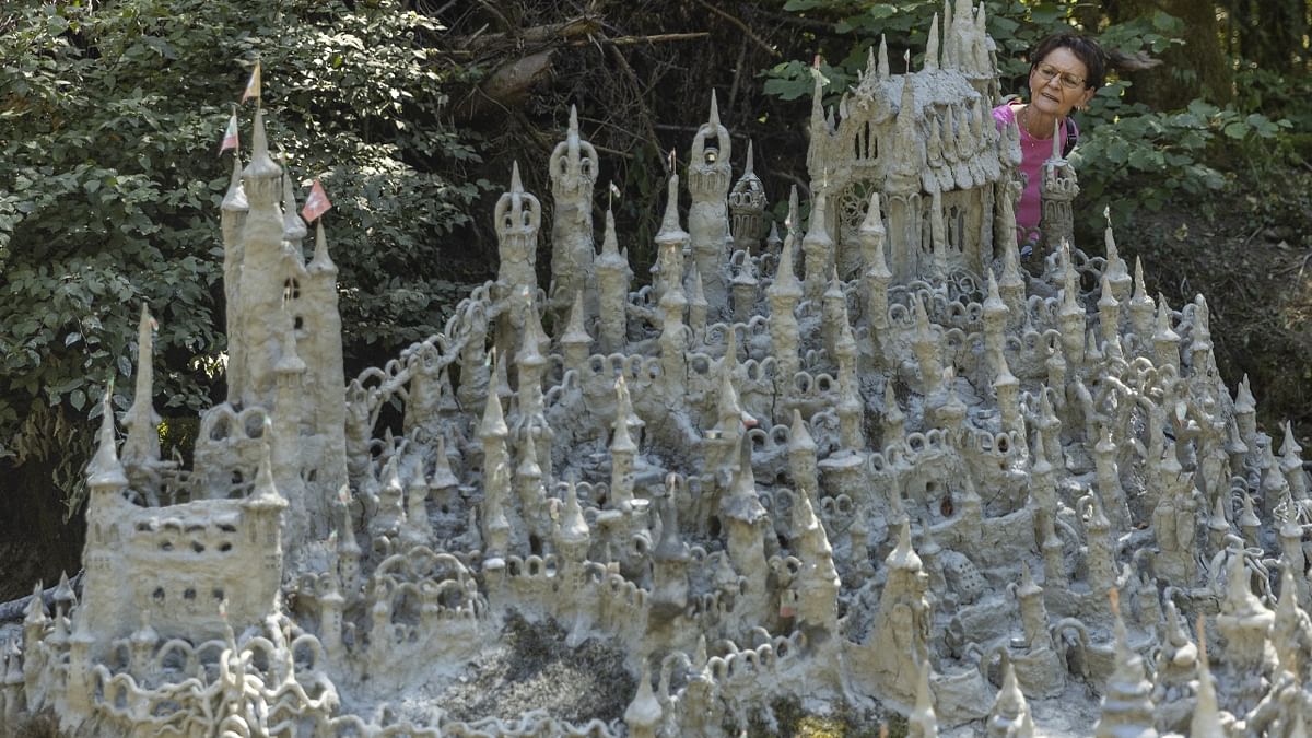 Swiss artist Francois Monthoux's annual project to build clay sculptures on the banks of Switzerland's Toleure river has sprawled into a captivating castle complex this year as the drought afflicting Europe allows him to extend his dream world. Credit: Reuters Photo