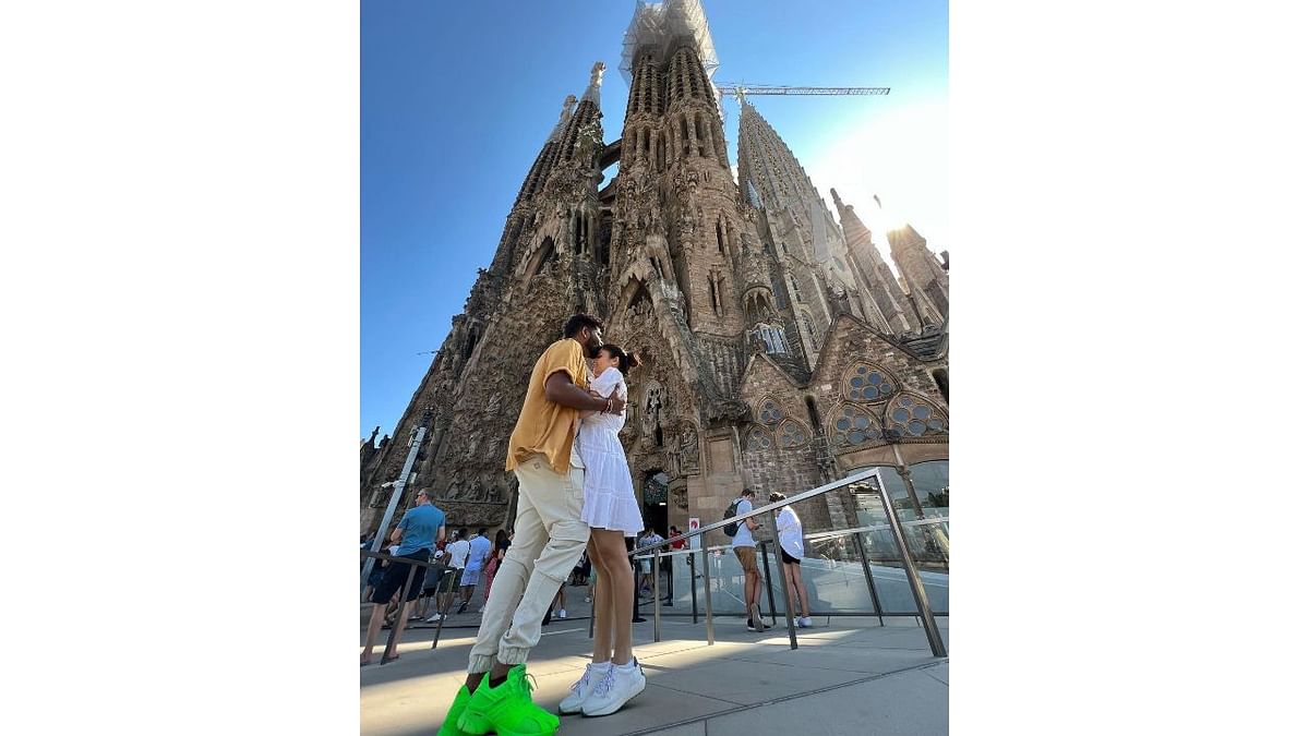 An adorable picture of the celebrity couple with Sagrada Família in the background. Credit: Instagram/wikkiofficial