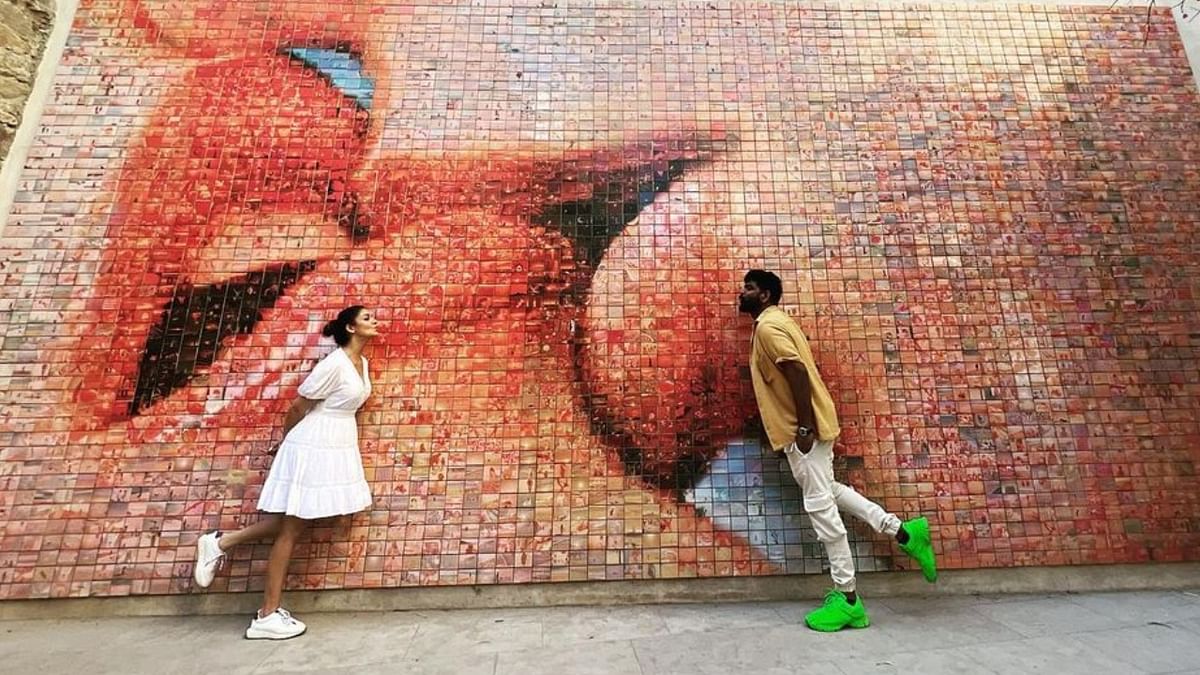 Nayanthara and Vignesh pose for a candid picture at the 'Kiss Wall.' Credit: Instagram/wikkiofficial