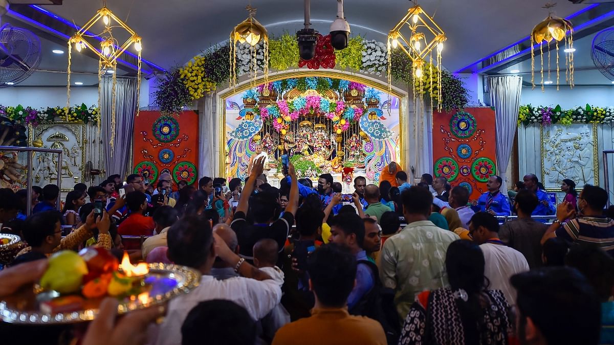 Devotees offer prayers to Lord Krishna on the occasion of 'Janmashtami', at an ISKCON temple in New Delhi. Credit: PTI Photo