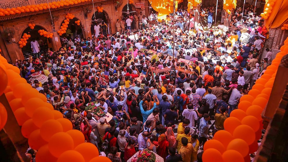 Devotees arrive to pay obesiance to Lord Bankey Bihari on the occasion of 'Janmashtami', at the Shri Bankey Bihari temple, in Vrindavan. Credit: PTI Photo