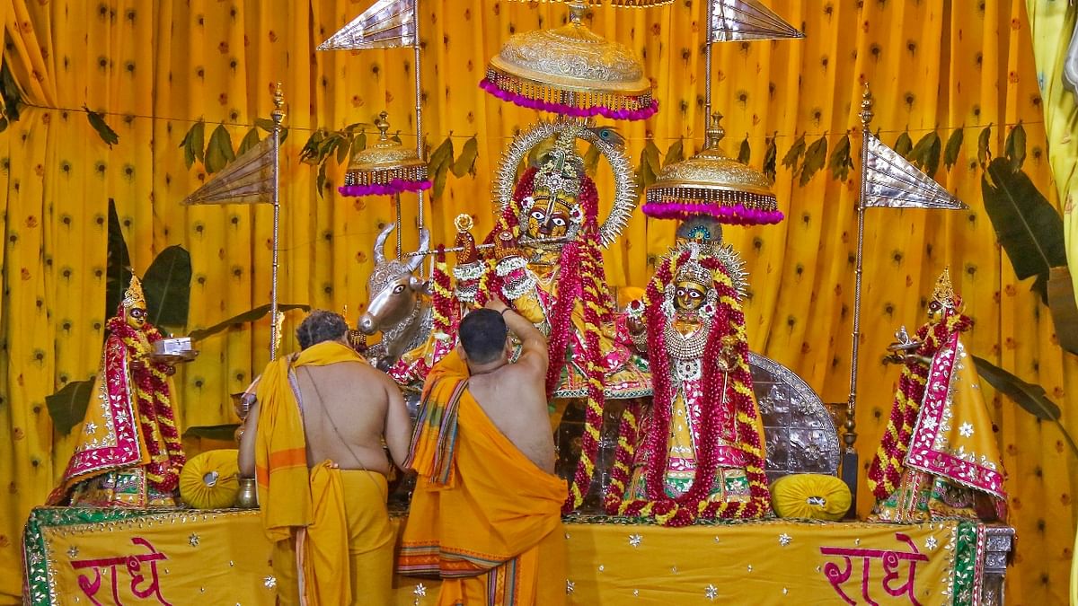 Priests perform puja during the 'Janmashtami' festival celebrations at the Govind Dev Ji temple, in Jaipur. Credit: PTI Photo