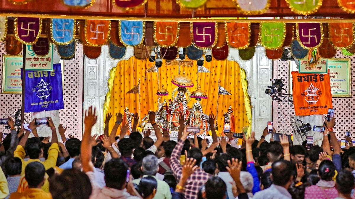 Devotees offer prayers at Govind Dev temple on 'Krishna Janmashtami' festival, in Jaipur. Credit: PTI Photo