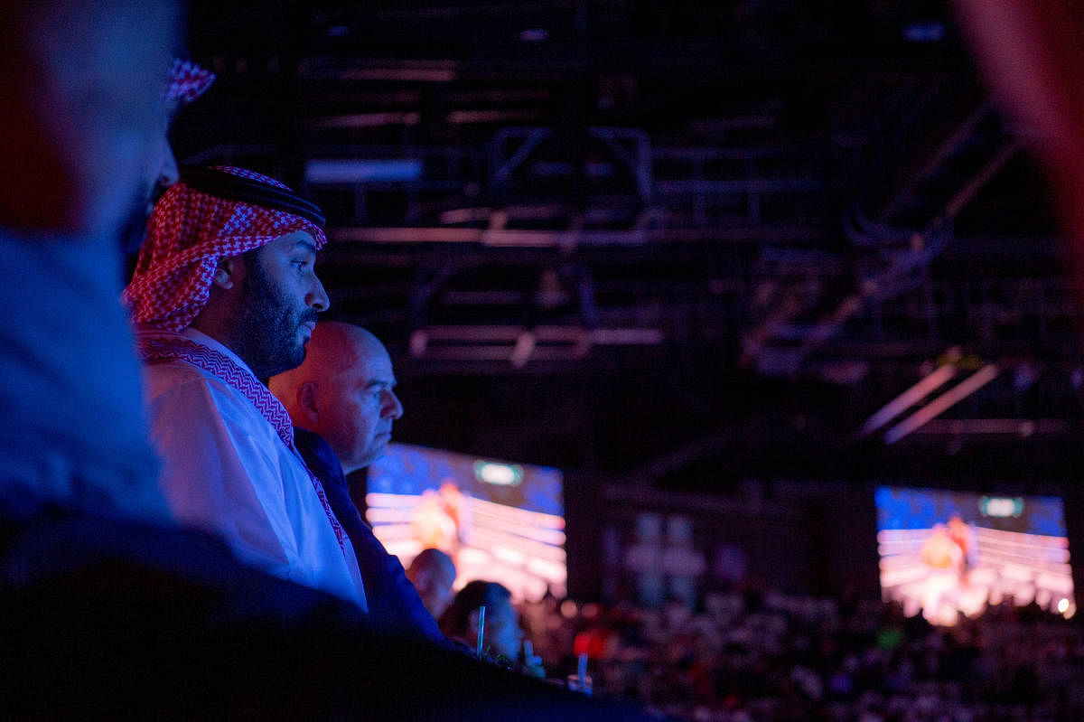 Saudi Crown Prince Mohammed bin Salman attends the Red Sea WBA, WBO and IBF heavyweight world title boxing fight, in King Abdullah Sports City Arena, Jeddah. Credit: Reuters Photo