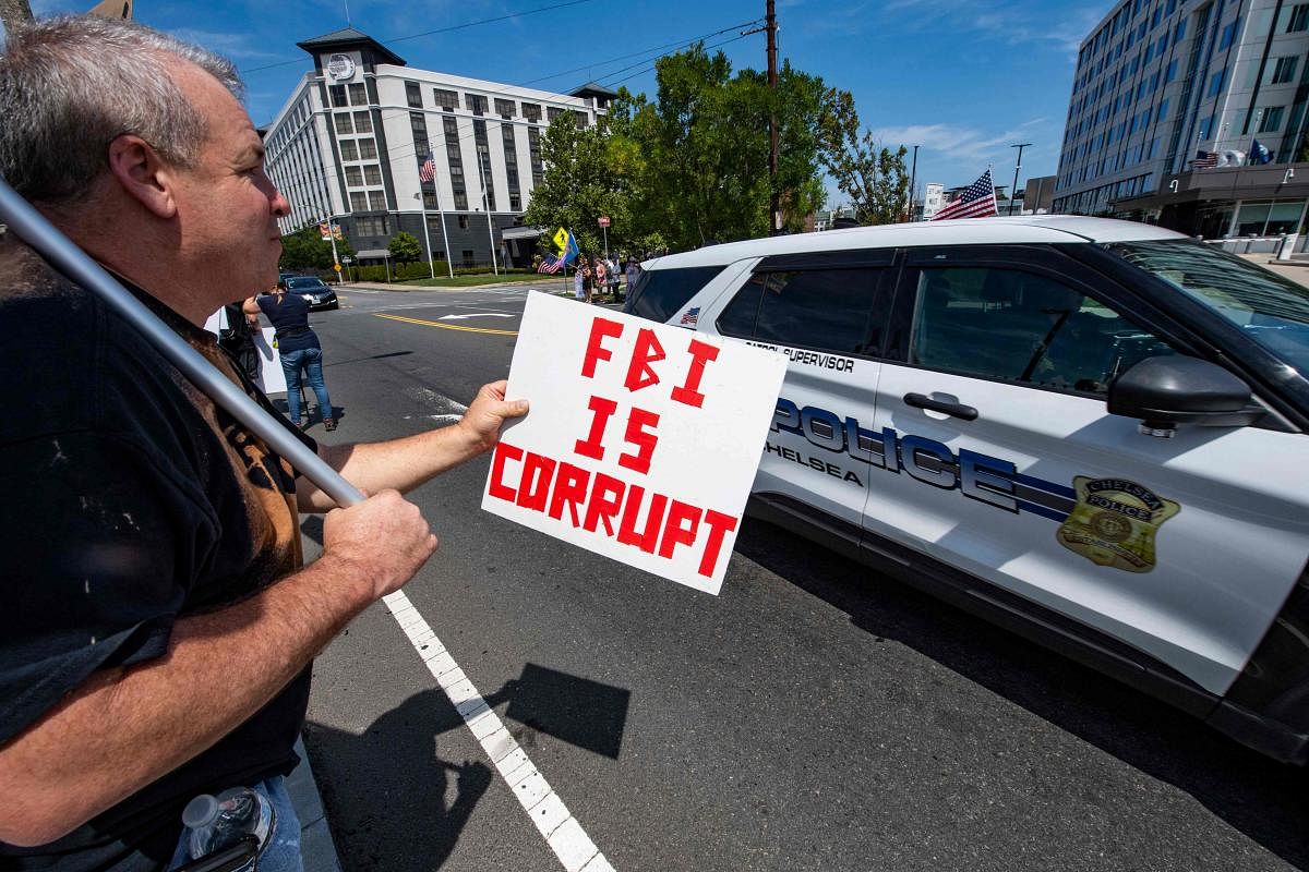Demonstrators protest the recent actions of the FBI at their Boston headquarters in Chelsea, Massachusetts. The protest is in reaction to the FBI’s investigation on former US President Donald Trump and the raid on his home in Florida. Members of Super Fun Happy America and CORR were present as well as Trump supporters. Credit: AFP Photo