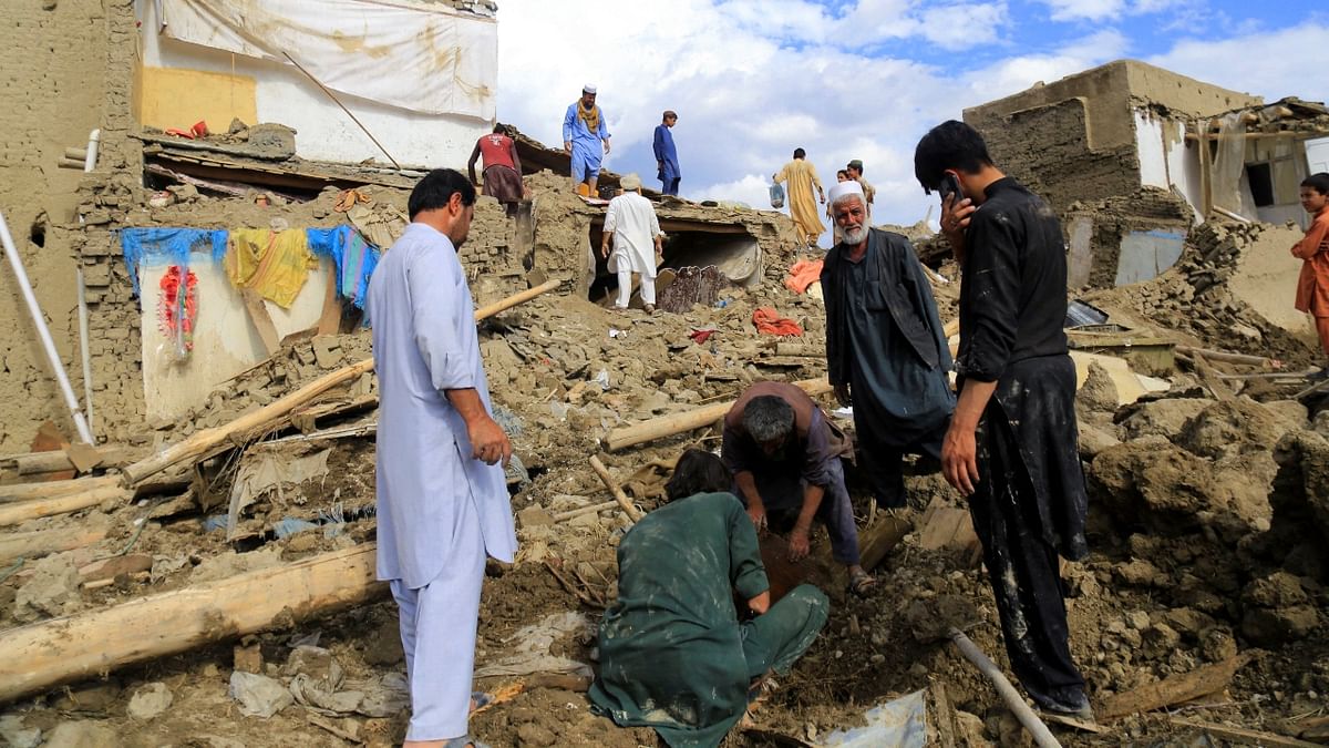 Visuals showed villagers in the Khushi district of Logar province south of the Afghan capital of Kabul cleaning up after the flooding, their damaged homes in disarray. Credit: Reuters Photo
