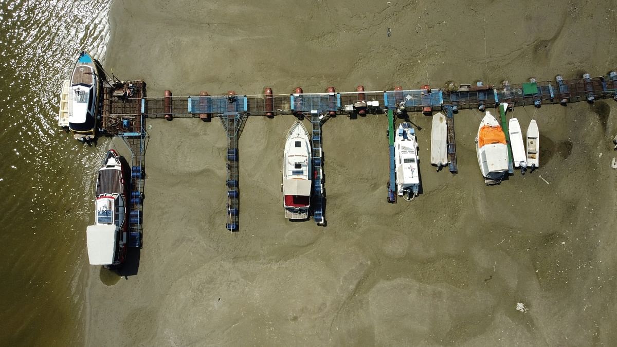 Boats lie on the dried riverbed of Danube in the city of Novi Sad, Serbia. Credit: Reuters Photo