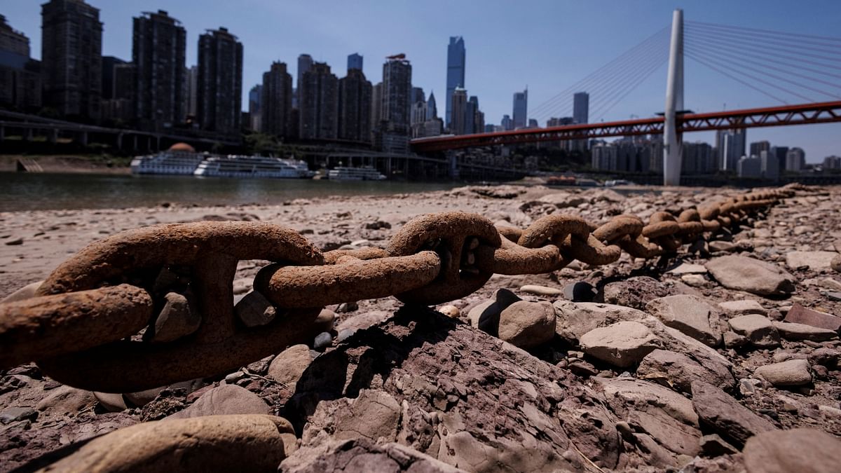 A chain that holds a boat jetty lies exposed on the dried-up riverbed of the Jialing river, a tributary of the Yangtze, in China. Credit: Reuters Photo