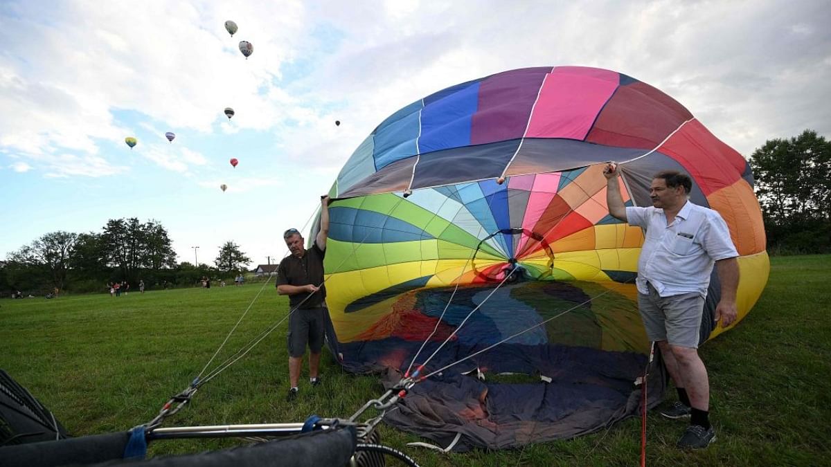 Competitors prepare for take off during the start of the 48th French Hot Air Balloon Championship in Bessoncourt, eastern France. Credit: AFP Photo