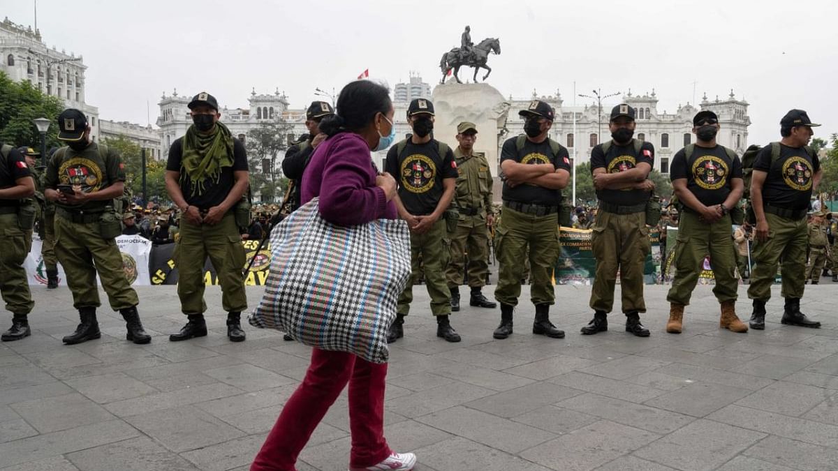 Peruvian non commissioned retired military personnel seeking benefits gather in downtown Lima on August 23, 2022, before being admitted into the Presidential Palace to meet President Pedro Castillo. Credit: AFP Photo