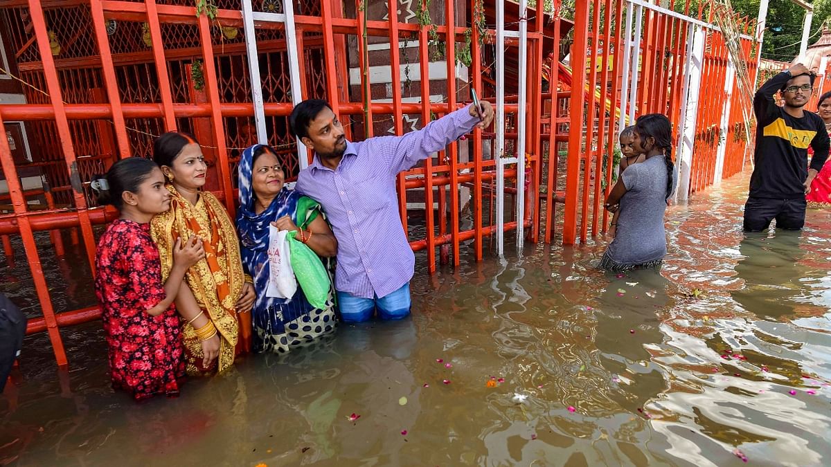 The rising waters of the Ganga River in Prayagraj also inundated the temples located on the banks of Sangam. Credit: PTI Photo